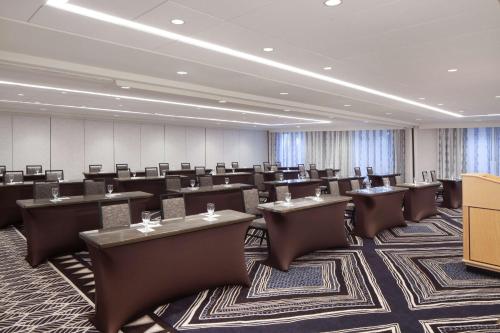 a large room with tables and chairs in it at Hilton Santa Cruz Scotts Valley in Santa Cruz