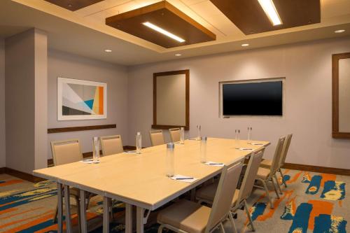 a conference room with a large table and chairs at DoubleTree by Hilton Pittsburgh - Cranberry in Cranberry Township