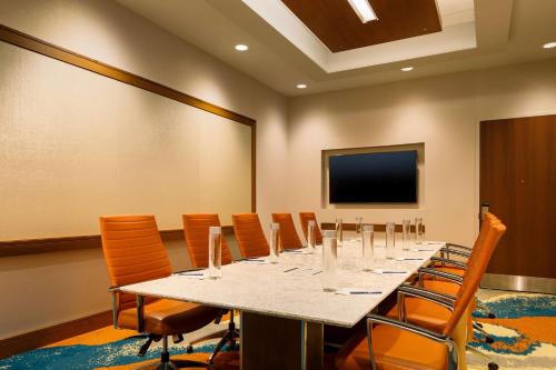 a conference room with a long table and chairs at DoubleTree by Hilton Pittsburgh - Cranberry in Cranberry Township