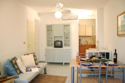a living room with a couch and a table at Guest House - La Sirena Salentina in Patù