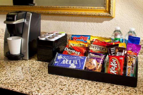a box of snacks and drinks on a counter at Embassy Suites by Hilton Dulles Airport in Herndon