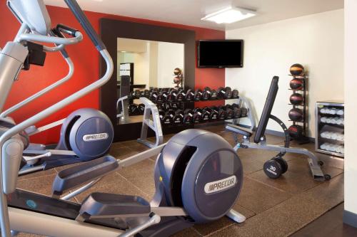 a gym with several treadmills and weights at DoubleTree by Hilton El Paso Downtown in El Paso