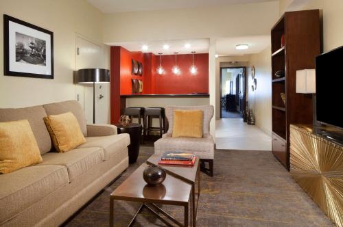 a living room with a couch and a table at DoubleTree by Hilton El Paso Downtown in El Paso