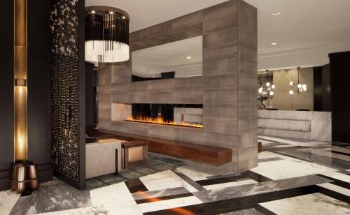 a lobby with a fireplace in a building at Hilton Boston Back Bay in Boston