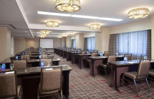 a conference room with tables and chairs and a whiteboard at Hilton Boston Back Bay in Boston