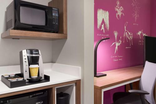 a room with a coffee maker and a microwave at Hilton Garden Inn Boulder in Boulder