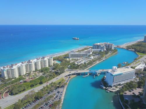 an aerial view of a city with a bridge over the water at Waterstone Resort & Marina Boca Raton, Curio Collection by Hilton in Boca Raton