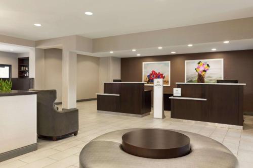 a lobby of a hotel with a round table at DoubleTree by Hilton Hotel Detroit Novi in Novi