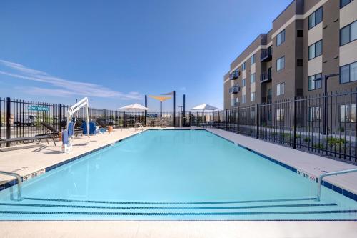 a large swimming pool in front of a building at WaterWalk Extended Stay by Wyndham Tucson in Tucson