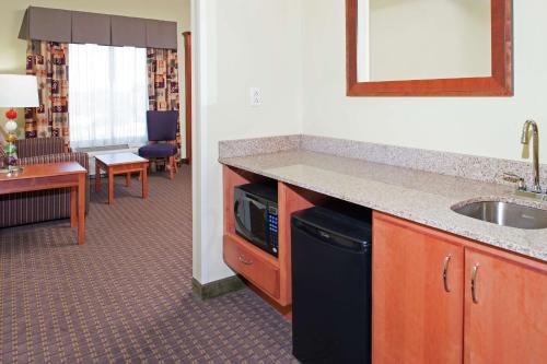 a kitchen with a sink and a counter top at Hampton Inn & Suites Moline-Quad City Int'l Aprt in Moline