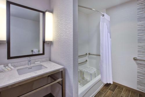 a bathroom with a sink and a shower at Hilton Garden Inn Chesterton in Chesterton