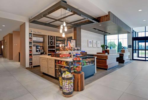a grocery store with a produce counter in a building at Hilton Garden Inn Madison Huntsville Airport in Madison