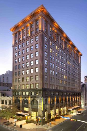 a large tall building with a lot of windows at Home2 Suites by Hilton San Antonio Downtown - Riverwalk, TX in San Antonio