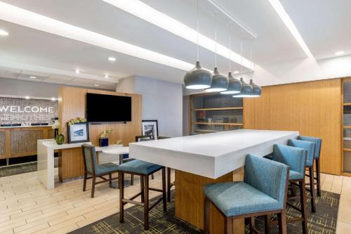 a conference room with a large white table and chairs at Hampton Inn Richmond/Midlothian Turnpike in Midlothian