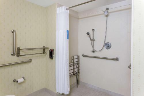 a bathroom with a shower and a toilet at Hampton Inn Richmond - South in Richmond