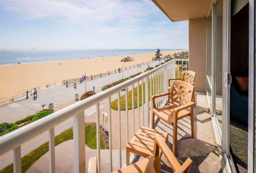 a balcony with a view of the beach at Hampton Inn Virginia Beach Oceanfront North in Virginia Beach