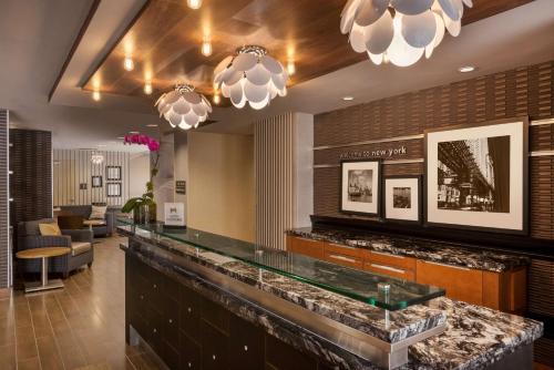 a bar in a hotel lobby with chandeliers at Hampton Inn Manhattan/Downtown- Financial District in New York