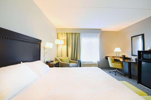 Ένα ή περισσότερα κρεβάτια σε δωμάτιο στο Hampton Inn & Suites Smithfield
