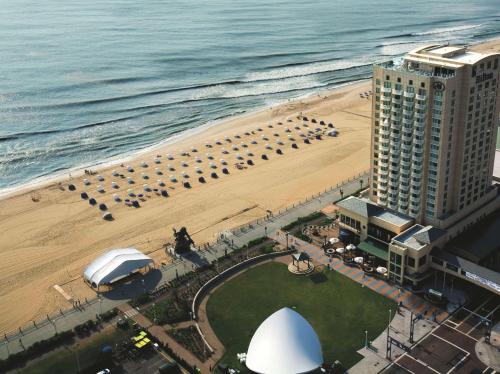 an aerial view of a hotel and the beach at Hilton Virginia Beach Oceanfront in Virginia Beach