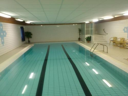 a large swimming pool in a building at Ildtoppen in Leirpollen