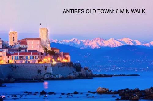 an old town on a hill with mountains in the background at Defoy Getaway - Antibes in Antibes