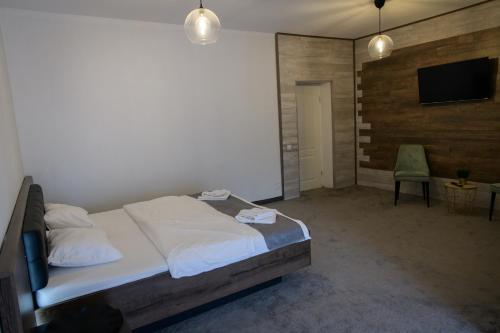 Ένα ή περισσότερα κρεβάτια σε δωμάτιο στο Hotel Vegas Negreni