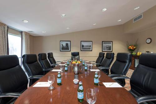 a conference room with a long table and chairs at DoubleTree by Hilton Hotel Grand Rapids Airport in Grand Rapids