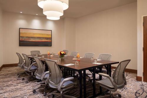 a conference room with a long table and chairs at Hilton Garden Inn Long Island City in Queens