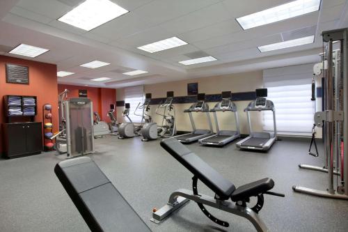 a gym with several treadmills and cardio machines at Hampton Inn & Suites Anaheim Garden Grove in Anaheim