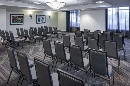 a room with a bunch of chairs in it at Hilton Garden Inn Tucson Airport in Tucson