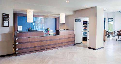 a lobby with a cash register and a restaurant at Hilton Garden Inn Providence in Providence