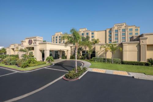 a rendering of a hotel with a parking lot at DoubleTree by Hilton Los Angeles/Commerce in Commerce