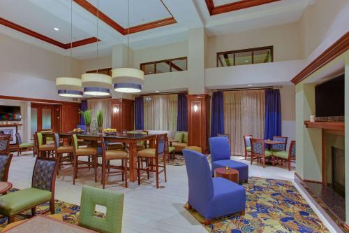 a dining room with a table and chairs at Hampton Inn and Suites Fredericksburg South in Fredericksburg