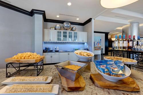 a kitchen with several bowls of food on a counter at Homewood Suites Nashville Vanderbilt in Nashville
