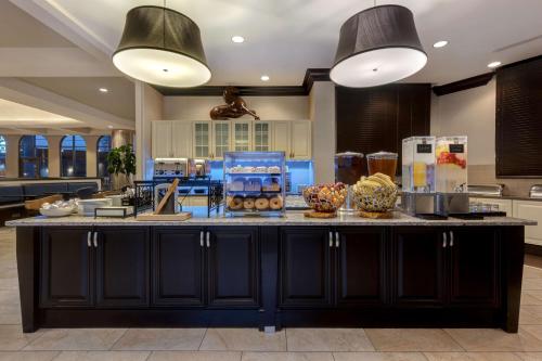 a kitchen with a large island with food on it at Homewood Suites Nashville Vanderbilt in Nashville