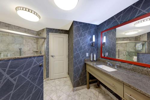 a bathroom with a sink and a mirror at Homewood Suites Nashville Vanderbilt in Nashville