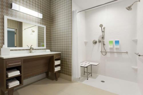 a bathroom with a sink and a shower at Home2 Suites By Hilton Florence Cincinnati Airport South in Florence