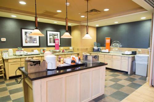 a fast food restaurant with a counter in the middle at Hampton Inn & Suites Dodge City in Dodge City