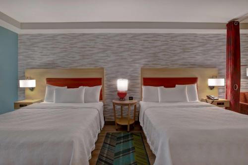 a hotel room with two beds and two lamps at Home2 Suites By Hilton San Antonio on the Riverwalk in San Antonio