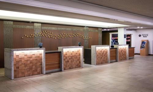 a lobby with a row of stalls in a building at DoubleTree by Hilton Portland in Portland