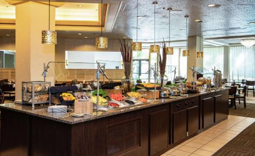 a buffet line in a restaurant with food on it at DoubleTree by Hilton Portland in Portland
