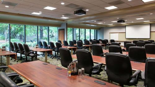 a conference room with tables and chairs and a screen at DoubleTree by Hilton Portland in Portland