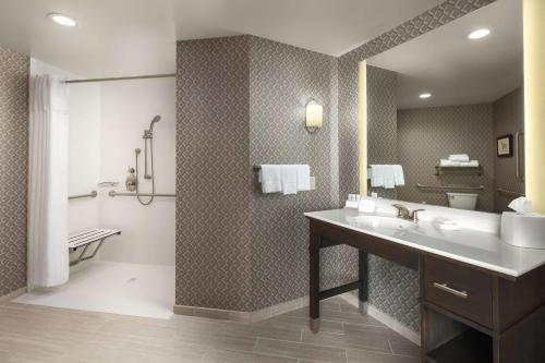 a bathroom with a sink and a toilet and a shower at Homewood Suites By Hilton Teaneck Glenpointe in Teaneck