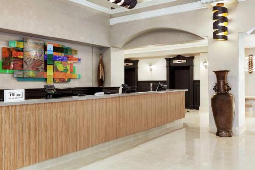a lobby with a reception desk in a building at Embassy Suites by Hilton Santa Ana Orange County Airport in Santa Ana