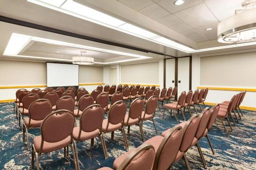 a conference room with chairs and a whiteboard at Embassy Suites San Luis Obispo in San Luis Obispo