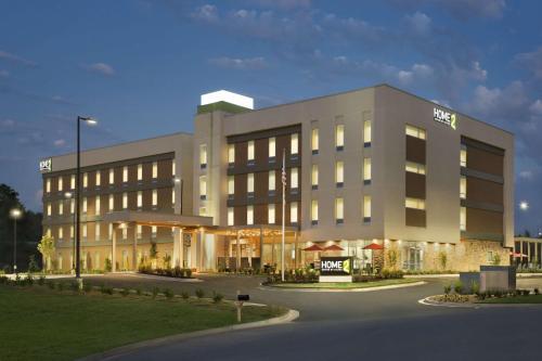 a large building with a sign in front of it at Home2 Suites by Hilton Grovetown Augusta Area in Augusta