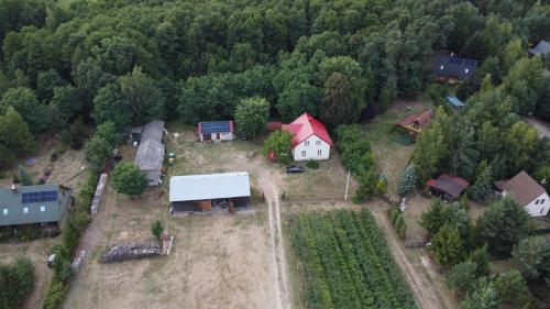 an aerial view of a house with a barn at Agroturystyka Zacisze nad Pilicą in Stromiec