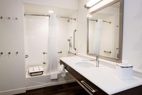 a bathroom with a sink and a shower at Hampton Inn Albany-Western Ave/University Area, NY in Albany