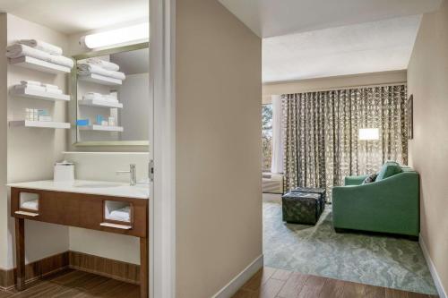 a bathroom with a sink and a mirror at Hampton Inn Richmond/Ashland in Ashland