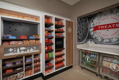 a grocery store aisle with shelves of food at Hampton Inn & Suites Oxford-Anniston in Oxford